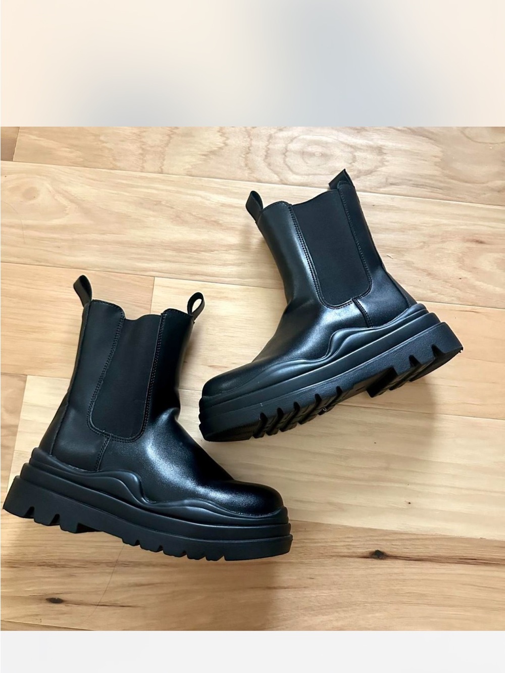 Black leather Chelsea boots with chunky sole